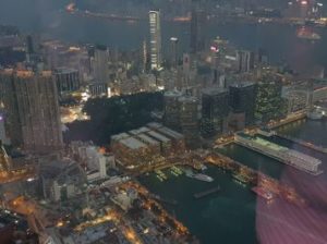 View from Sky 100 Observation deck at evening – Hong Kong. Female solo traveller in Asia