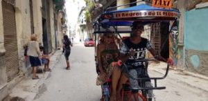 guide to a solo vacation in Havana Cuba,riding in bicycle taxi in Havana Cuba