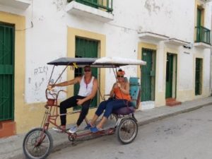 guide to a solo vacation in Havana Cuba,riding in bicycle taxi in Havana Cuba