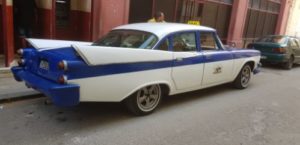 Classic 19th century cars in Havana Cuba. guide to a solo vacation in Cuba