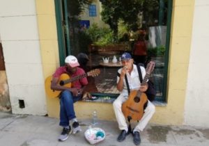 locals singing and enjoying the day in Havana Cuba.