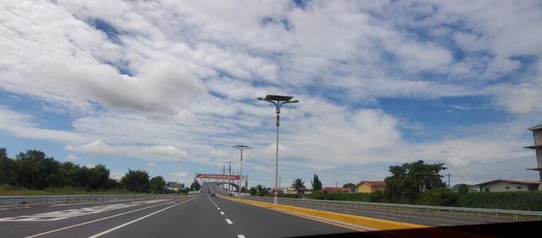 Approaching entry to the Bharrat Jagdeo Demerara River Bridge. Guyana, the Land of Many Waters
