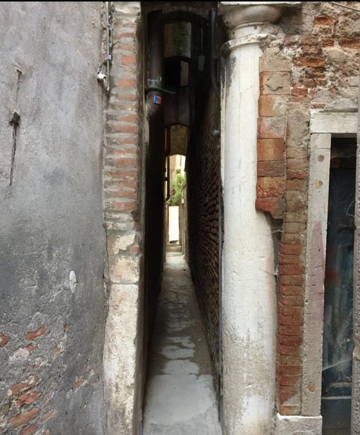 Calle Varisco (the narrowest street or Alley in Venice). Venice, Italy’s floating city