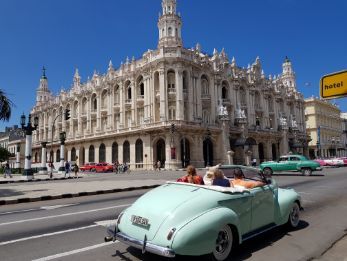 Classic car in front of the Grand Theatre of Havana
