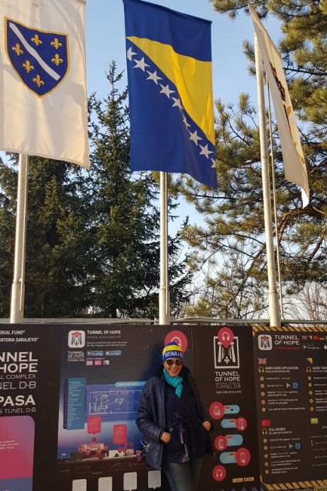 Coradexplorer in the Bosnian hat with the Bosnian flag above. solo traveller in Sarajevo, Bosnia and Herzegovina.