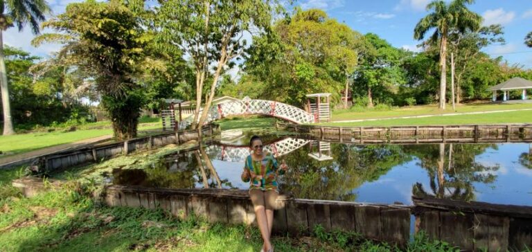 Enjoying the scenery of the Kissing Bridge (Botanical . Gardens) - GeorgetownGuyana, the Land of Many Waters