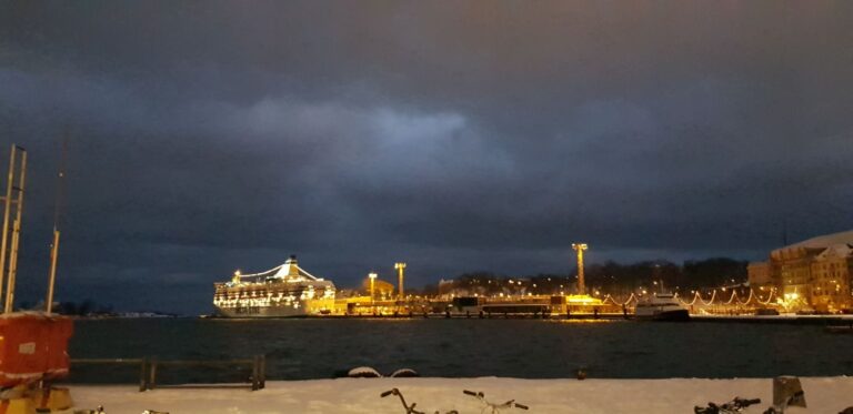 Night view of the city and the Vikings inter-island ferry. Finland is the happiest country on earth