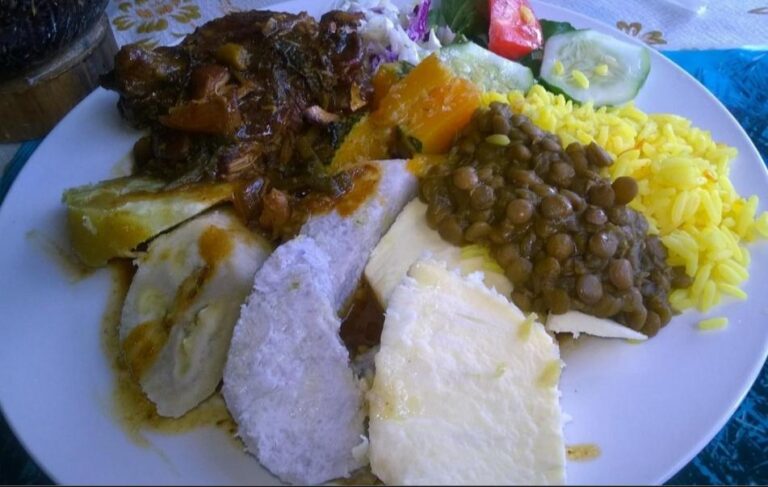 Typical Dominican dish – Breadfruit, yam, Dasheen, Plantain, banana, lentils, and stew. Dominica, the Nature Island of the Caribbean.